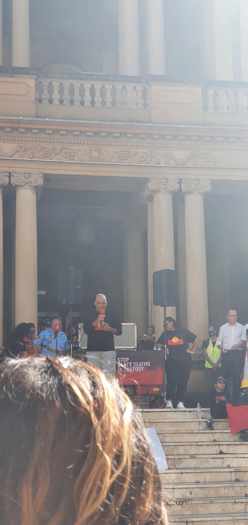 Brothers Beyond Bars reading a poem on the steps of Town Hall