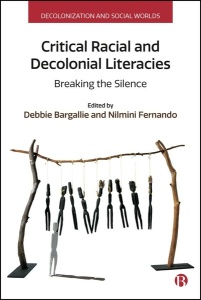 Book cover for Critical Racial and Decolonial Literacies. Cover is white with an image of the artwork 'Annihilation of the Blacks' by Fiona Foley. This depicts black stick figures hung from two trees and a white figure watching on the ground