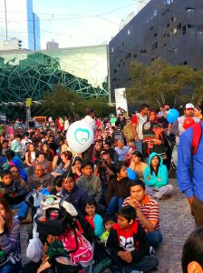 Young children watch the festivities with their families at the Diwali Festival of Light