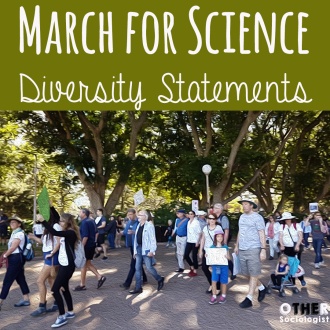 Crowd of families marches through a park in Sydney