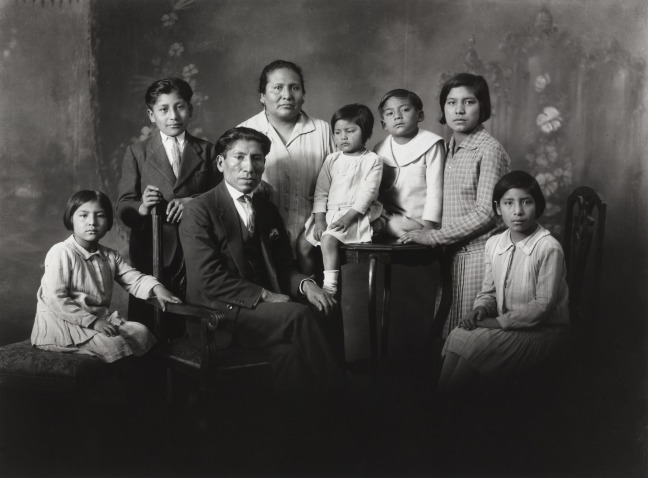 Quechuan family sit for a portrait